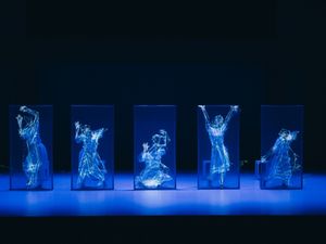 A dancer paired with real-time motion capture and generative visuals.
