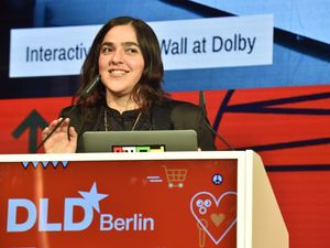 Josette Melchor speaking on stage at the DLD conference in Berlin.