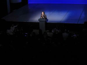 Josette Melchor at the podium introducing Gray Area's tenth-anniversary program.